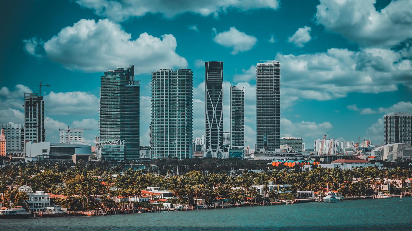 Miami Edgewater and downtown skyline with new condo towers and construction cranes rising over Biscayne Bay in 2026
