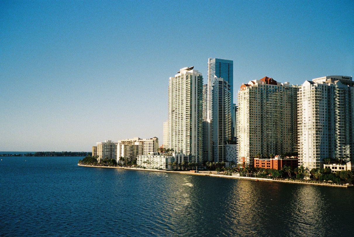 Aerial view of Miami waterfront condo towers along Biscayne Bay sold off-plan on staged deposit schedules