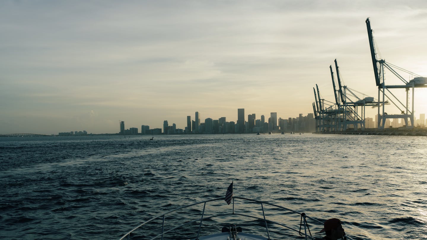 Miami skyline and PortMiami seen from Biscayne Bay, gateway for international real estate capital