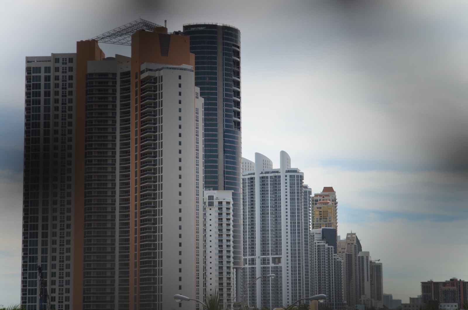 Oceanfront condo towers lined along the shoreline in Sunny Isles Beach