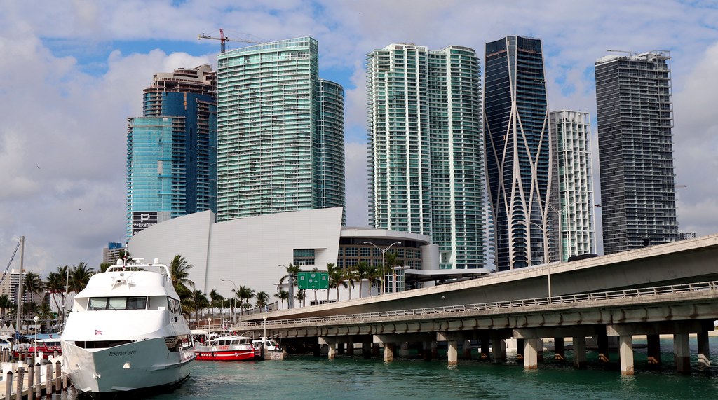 Downtown Miami waterfront high-rise condos with a yacht on Biscayne Bay