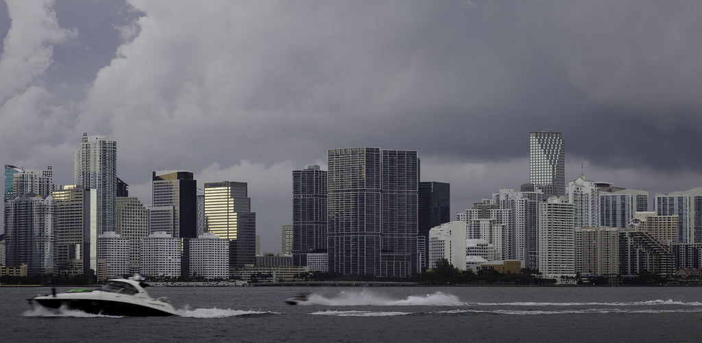 Brickell waterfront condo skyline with boats on Biscayne Bay