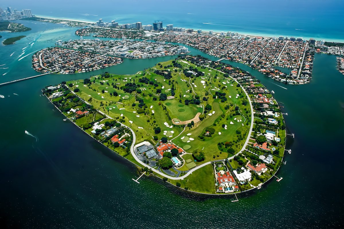 Aerial view of Indian Creek Village, the 300-acre private island in Biscayne Bay with 41 estate homes and a private golf course, known as the Billionaire Bunker