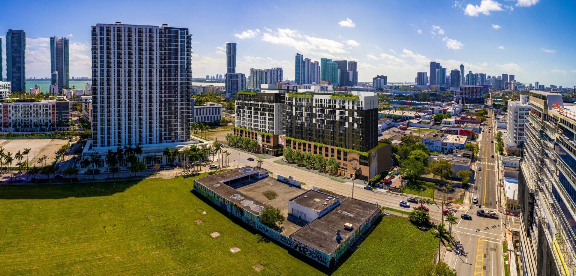 Rendering of the cobblestone paseo and ground-floor retail at Mohawk at Wynwood, Miami